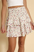 Automotive part from Jade Icarus with floral design, smocked ruffle details, mini skirt style, colorful fabric pattern.