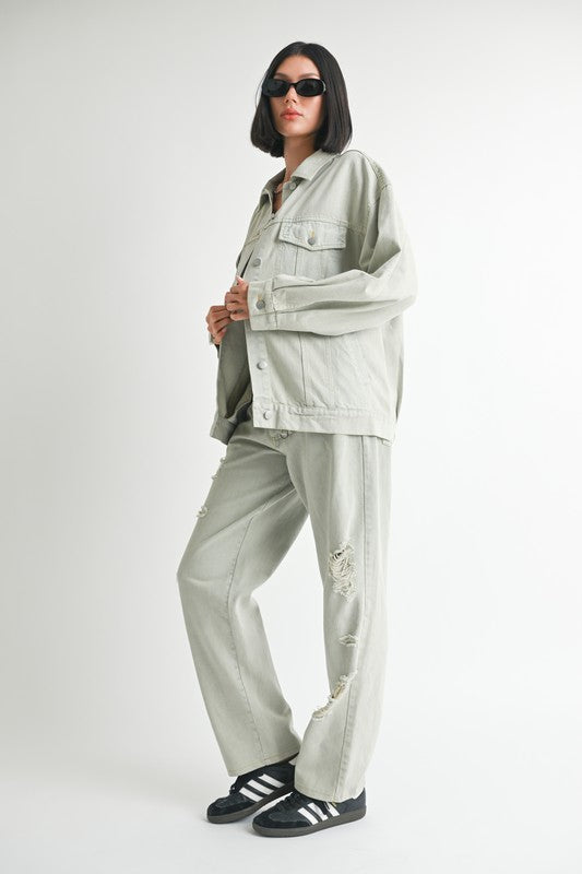 Women’s oversized denim jacket by Jade Icarus, relaxed fit with classic blue denim, detailed stitching, and button front.