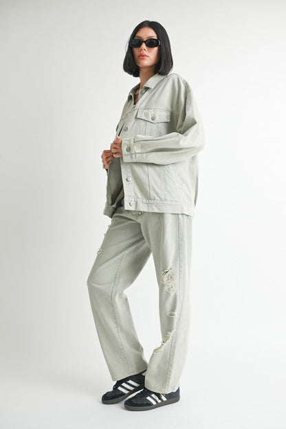 Women’s oversized denim jacket by Jade Icarus, relaxed fit with classic blue denim, detailed stitching, and button front.