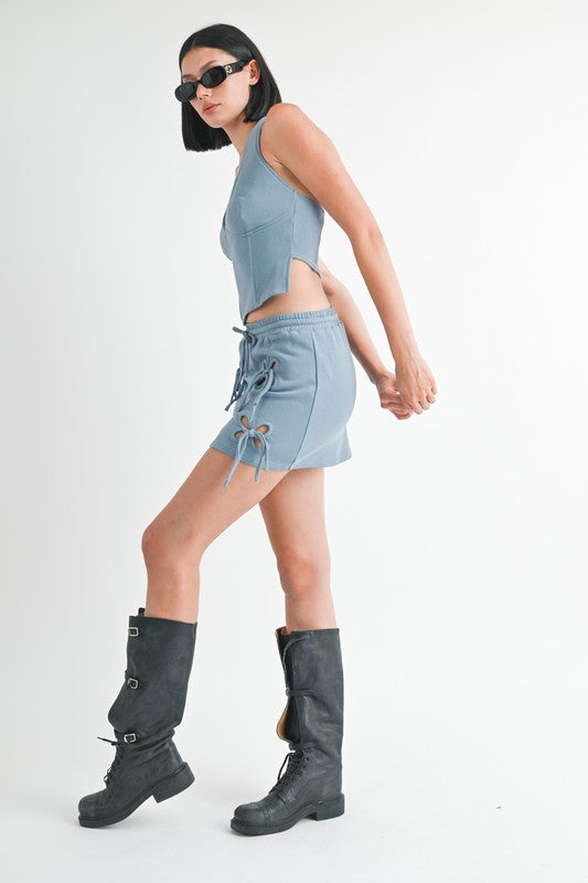 Jade Icarus French Terry Cutout Mini Skirt, automotive design with cutout details, shown in a sleek, fitted style.
