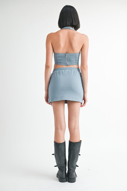 Jade Icarus French Terry Cutout Mini Skirt in stylish fabric, featuring a cutout design and a fitted silhouette.