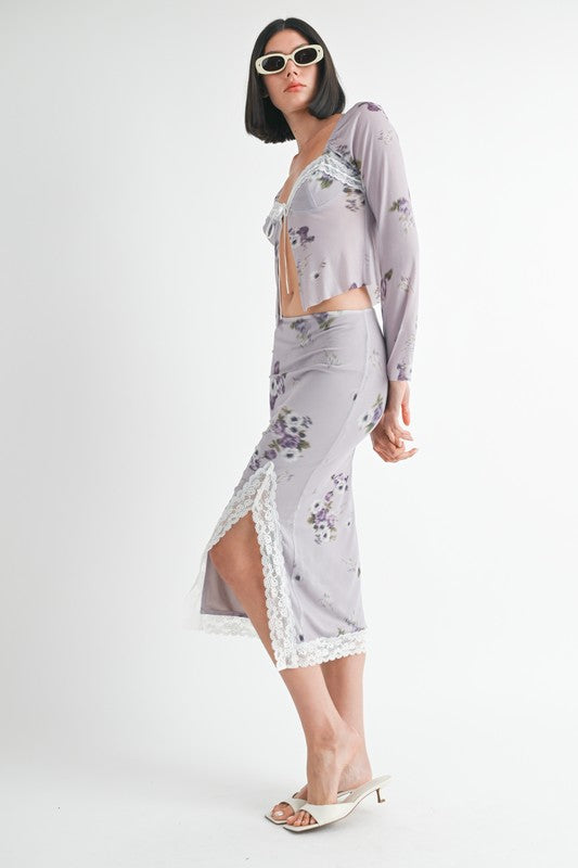 Automotive floral midi skirt with lace trim by Jade Icarus, featuring a flowy fabric and intricate lace detailing.