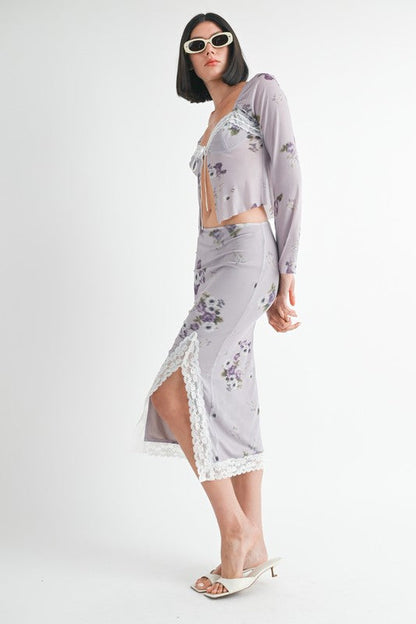 Automotive floral midi skirt with lace trim by Jade Icarus, featuring a flowy fabric and intricate lace detailing.