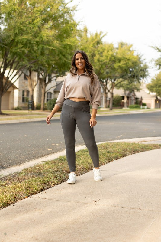 Charcoal crossover leggings for women by Jade Icarus, featuring a stylish and comfortable fit.
