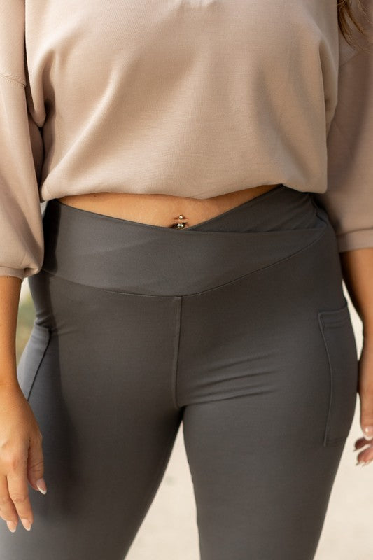 Charcoal crossover leggings for women by Jade Icarus, featuring a stylish fitted design and comfortable stretch fabric.