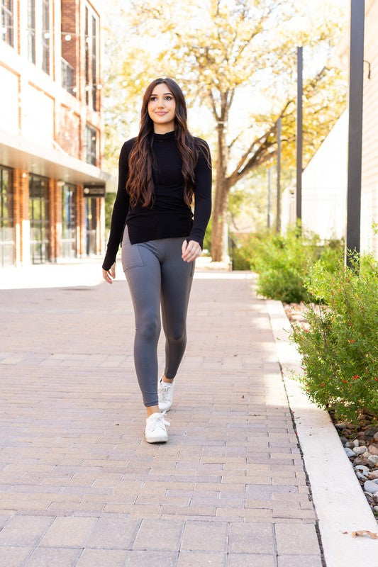 Charcoal crossover leggings for women by Jade Icarus, featuring a stylish design and comfortable fit in a close-up image.