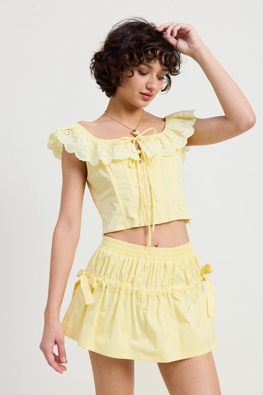 Jade Icarus MNII ruched poplin mini skirt in automotive style, shown in a detailed image highlighting the fabric texture and ruching.
