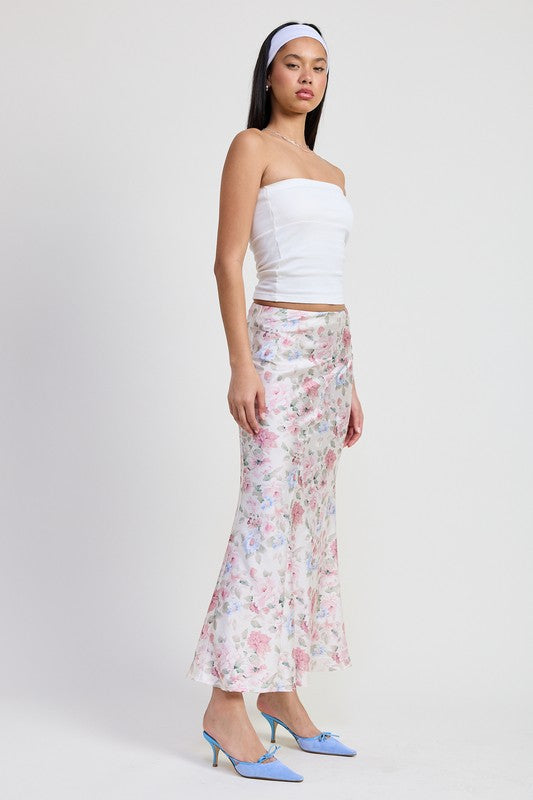 Automotive bias floral maxi skirt by Jade Icarus with vibrant floral pattern and flowing design, displayed on a hanger.
