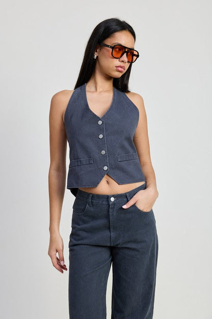 Fitted denim pants folded, showcasing Jade Icarus automotive apparel with detailed stitching and fabric texture.