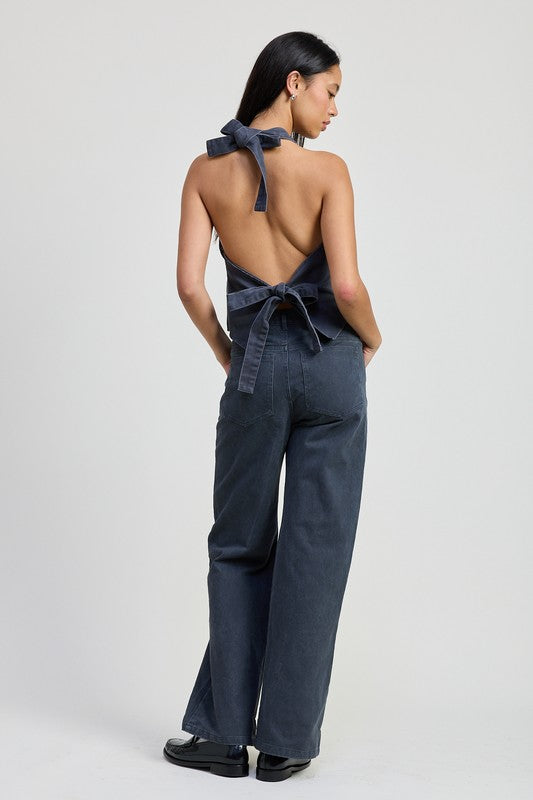 Faded denim fitted pants by Jade Icarus, folded and displayed on a plain background, showcasing their slim fit and classic design.