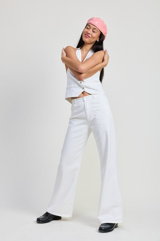 Fitted denim pants folded neatly, showcasing Jade Icarus branding on the automotive-themed clothing item.