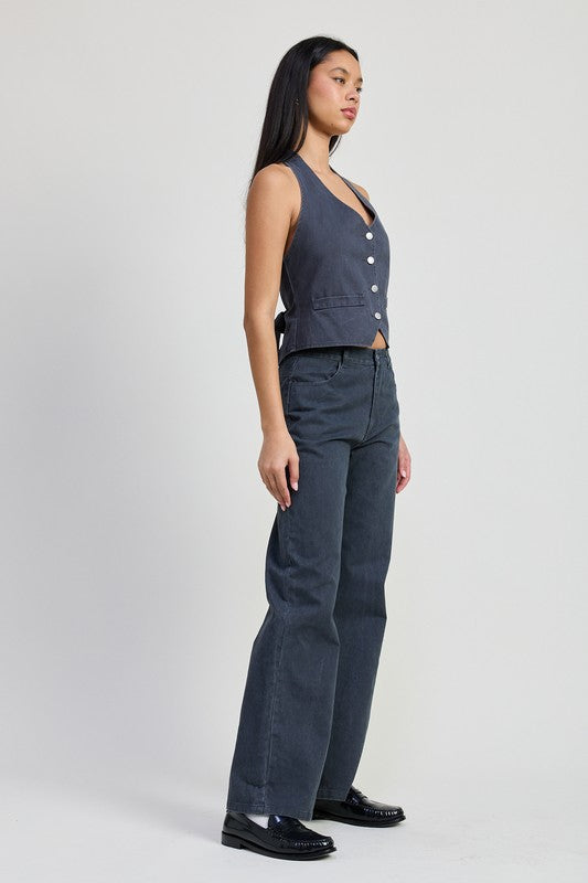 Fitted denim pants by Jade Icarus, folded, showcasing their slim fit and classic blue denim fabric.