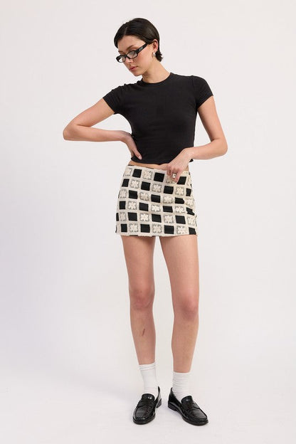 Automotive miniature jacquard skirt by Jade Icarus, featuring detailed fabric pattern and sleek design.