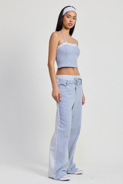 Jade Icarus double waist straight-leg pants in black fabric, featuring a high waist and tailored fit for a modern look.