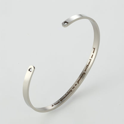 Personalized steel couple bracelet for him and her, sleek design by Carmine Juneberry, featuring engraved custom details.