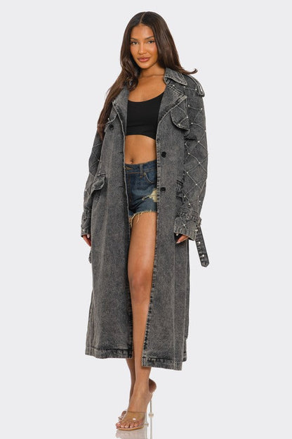 Distressed denim trench coat by Jade Icarus, automotive-themed outerwear with a rugged, worn-in look featuring distressed fabric and classic design.