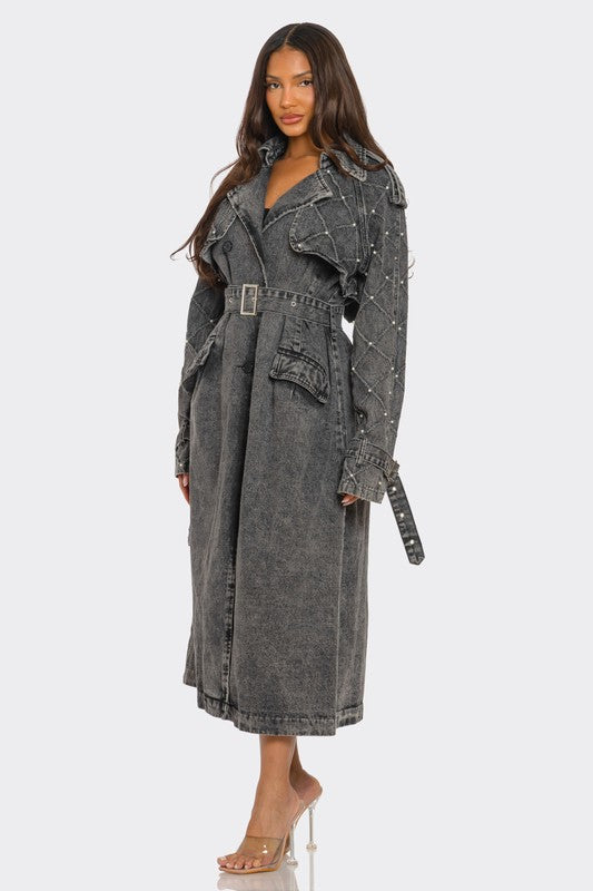 Distressed denim trench coat by Jade Icarus featuring automotive-inspired design and rugged, worn-in denim style.