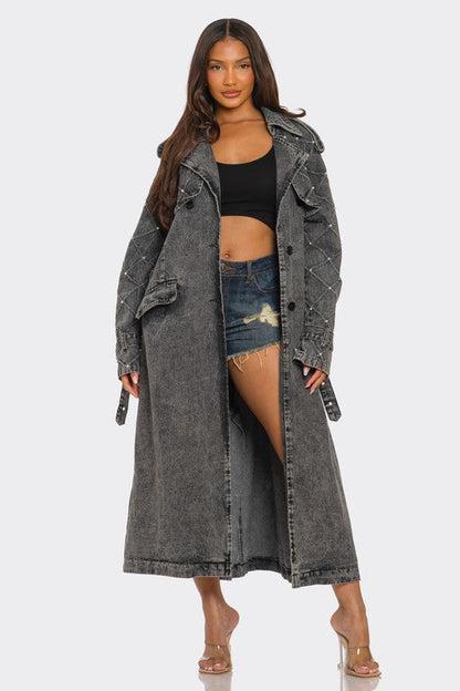 Distressed denim trench coat by Jade Icarus featuring automotive-inspired design with rugged, worn denim look.