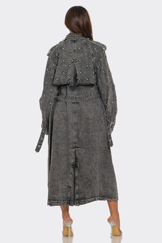 Distressed denim trench coat by Jade Icarus, featuring automotive-inspired design with rugged, worn denim fabric.