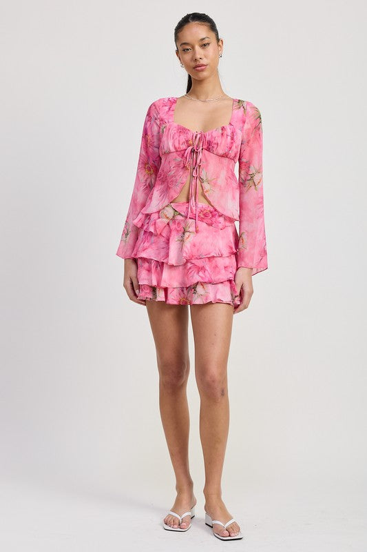 Automotive ruffle mini skirt by Jade Icarus featuring a stylish ruffled design and vibrant fabric, displayed on a model.