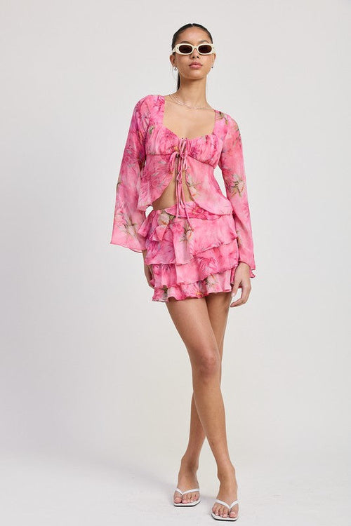 Automotive Ruffle Mini Skirt by Jade Icarus, featuring a sleek design and stylish ruffle details, shown in the product image.