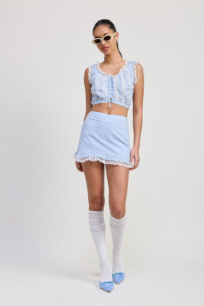 Automotive ruffled mini skirt with lace detail by Jade Icarus, featuring intricate lace accents and ruffled fabric design.