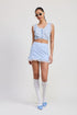 Automotive ruffled mini skirt with lace detail by Jade Icarus, featuring intricate lace accents and ruffled fabric design.