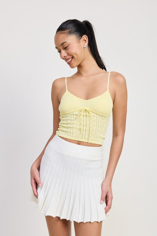 Automotive Jade Icarus pleated mini skirt, stylish design with pleats, displayed on a white background.