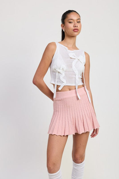 Jade Icarus pleated mini skirt in vibrant automotive fabric, shown with detailed pleats and stylish design.