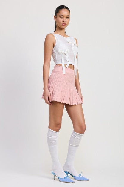 Automotive Jade Icarus pleated mini skirt with sleek design and detailed fabric texture, displayed on a neutral background.