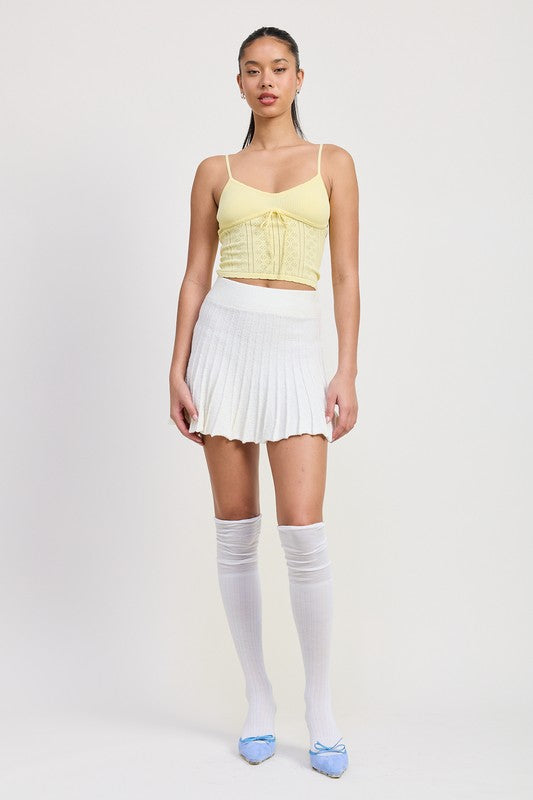 Automotive Jade Icarus pleated mini skirt featuring a sleek, stylish design with sharp pleats and modern detailing.