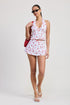 Women’s poplin print mini skirt with ribbon trim by Jade Icarus, featuring a vibrant pattern and stylish detail.