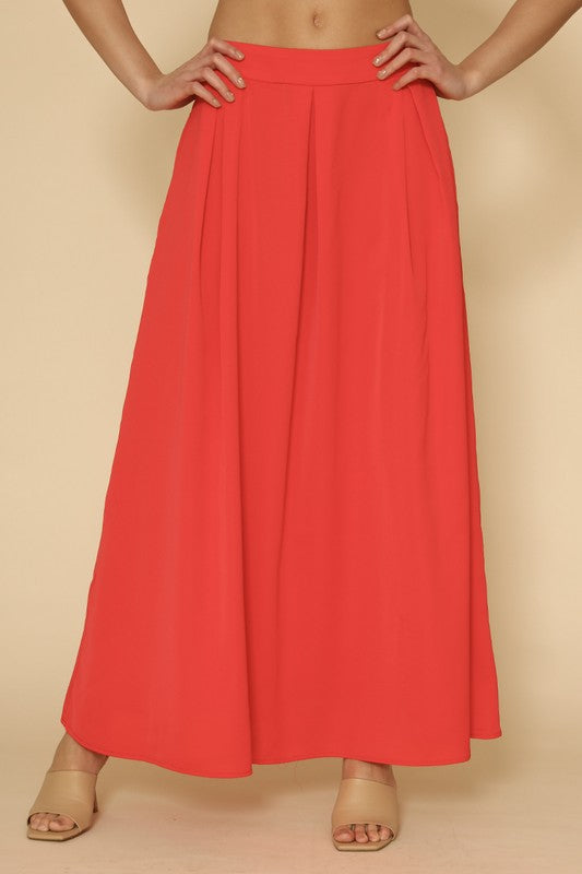 Automotive Jade Icarus high waist pleated skirt with detailed pleats and structured design, showcased in a clear product image.