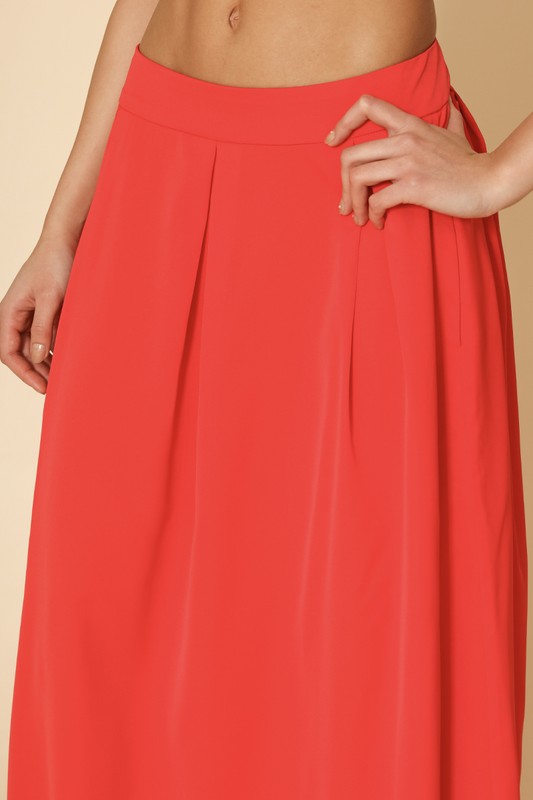 Automotive-themed Jade Icarus high waist pleated skirt with a sleek, structured design, featuring pleats and a high waist fit.