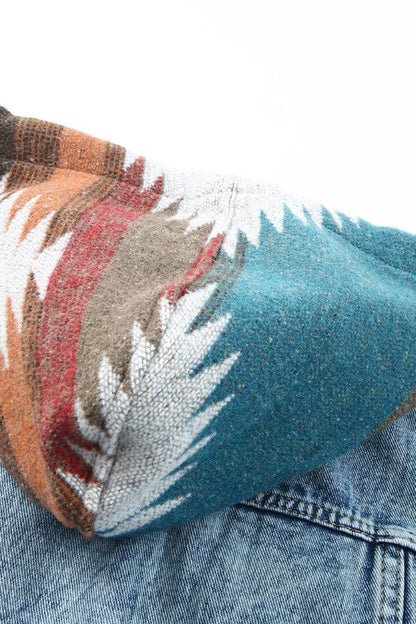 Automotive-style Jade Icarus denim jacket with geometric print, frayed hem, and classic denim texture.