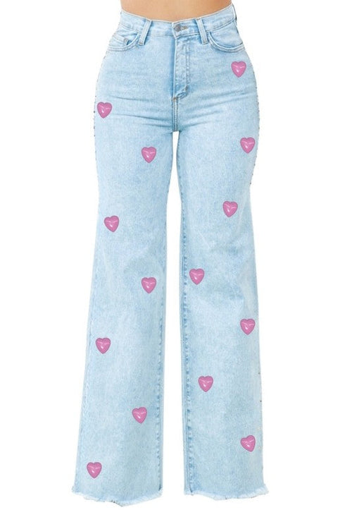 Jade Icarus Brooklyn wide leg jeans with heart detail, featuring a relaxed fit and classic denim fabric on a model.