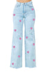 Jade Icarus Brooklyn wide leg jeans with heart detail, featuring a relaxed fit and classic denim fabric on a model.