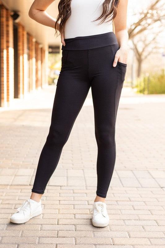 Jade Icarus Sleek Pocket Collection full-length automotive leggings with functional pockets, black fabric, and slim fit design.