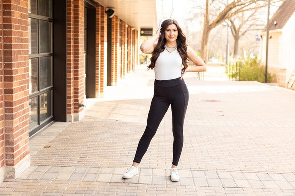 Full-length Jade Icarus Sleek Pocket Collection automotive leggings displayed on a model, showcasing their slim fit and stylish design.