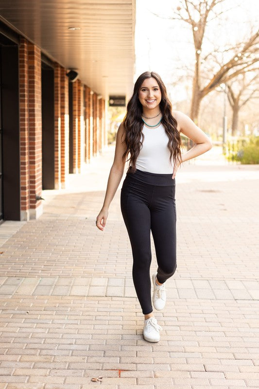 Jade Icarus Sleek Pocket Collection full-length automotive leggings with stylish design and functional pockets.
