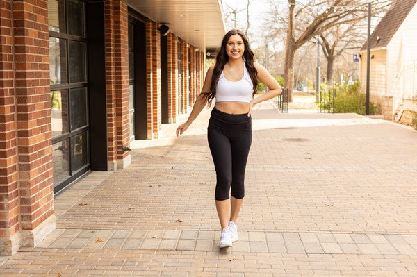 Jade Icarus Sleek Pocket Collection Capri Leggings for women, shown in a stylish, form-fitting design with side pockets.