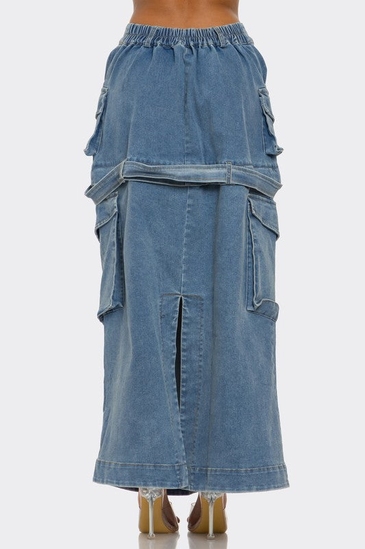 Jade Icarus utility denim maxi skirt with functional pockets, styled for casual wear, shown in a natural outdoor setting.