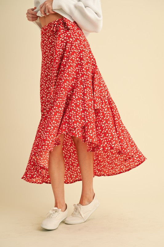 Jade Icarus Berti floral wrap skirt with vibrant flower patterns and flowing fabric, showcasing a stylish and colorful design.