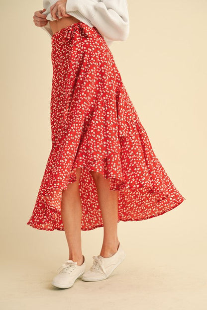 Jade Icarus Berti floral wrap skirt with vibrant flower patterns and flowing fabric, showcasing a stylish and colorful design.