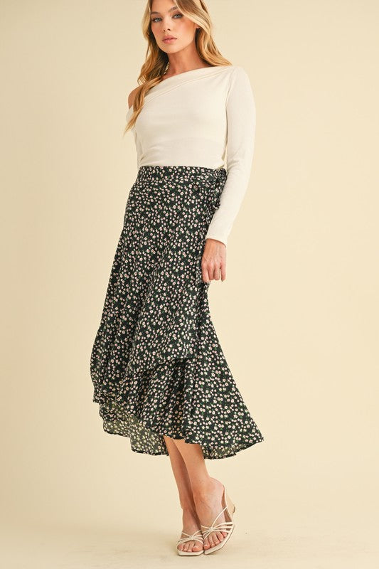 Automotive Berti Floral Wrap Skirt by Jade Icarus, featuring a vibrant floral wrap design on a sleek fabric.