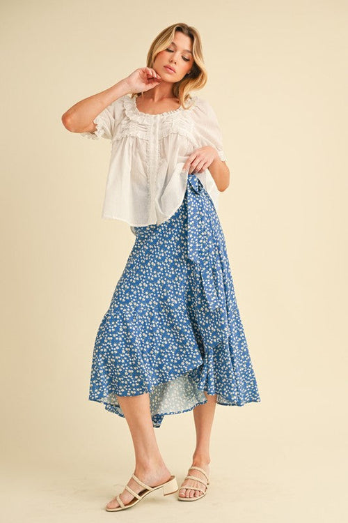 Automotive Berti Floral Wrap Skirt by Jade Icarus featuring a vibrant floral pattern and wrap design for a stylish look.