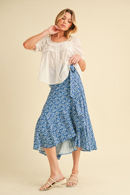 Automotive Berti Floral Wrap Skirt by Jade Icarus featuring a vibrant floral pattern and wrap design for a stylish look.