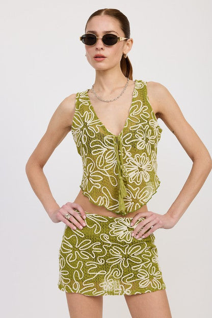 Low rise printed mini skirt by Jade Icarus featuring vibrant automotive-inspired patterns and a fitted, stylish cut.