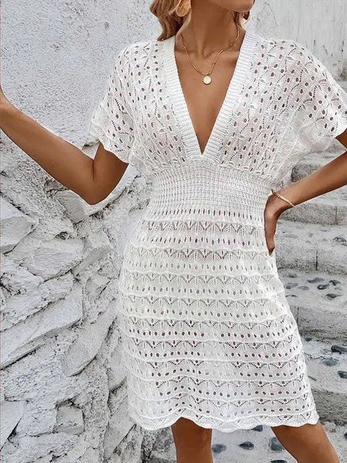 Deep V eyelet cover-up dress by Jade Icarus, featuring a sleeveless design with eyelet fabric and a relaxed fit for beachwear.