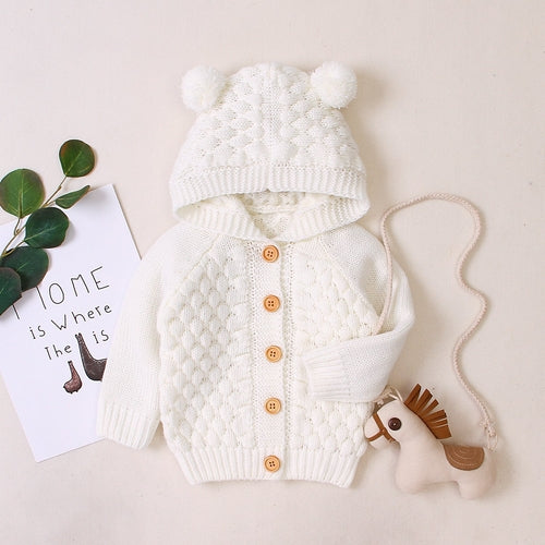 Carmine Juneberry KuschelGlöckchen™ baby hooded knit jacket with pom-pom, soft and cozy for infants.
